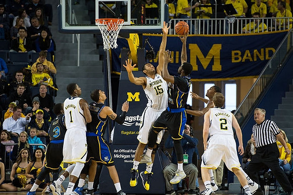 Glenn Robinson III (1), Jon Horford (15), and Spike Albrecht (2)