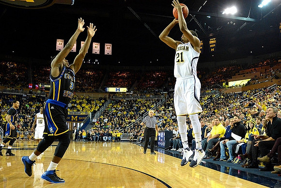 Derrick Walton Jr. (10) and Zak Irvin (21)