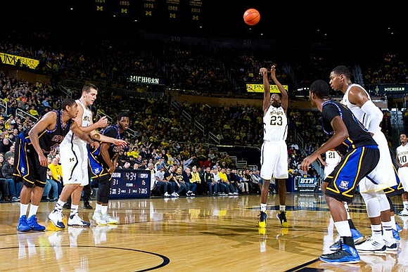 Mitch McGary (4), Caris LeVert (23), Zak Irvin (21), Derrick Walton Jr. (10), and Glenn Robinson III (1)