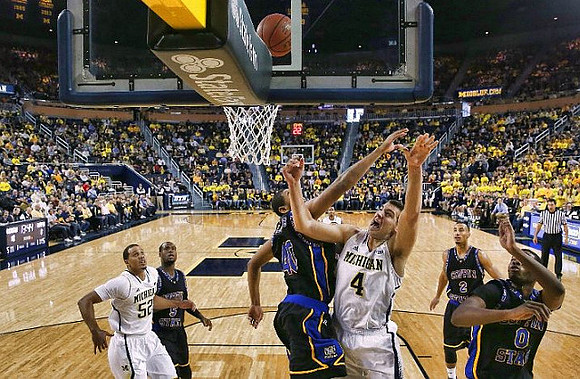 Jordan Morgan (52) and Mitch McGary (4)