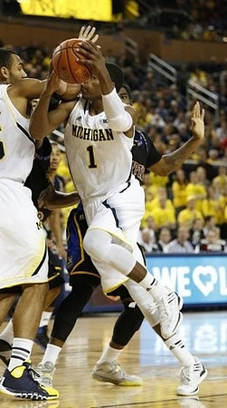 Jon Horford (15) and Glenn Robinson III (1)