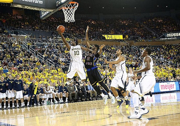 Derrick Walton Jr. (10), Jon Horford (15), Spike Albrecht (2), and Zak Irvin (21)
