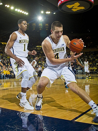 Glenn Robinson III (1), Mitch McGary (4), and Caris LeVert (23)