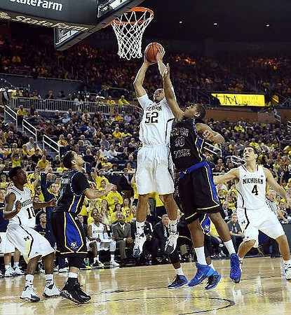 Derrick Walton Jr. (10), Jordan Morgan (52), and Mitch McGary (4)