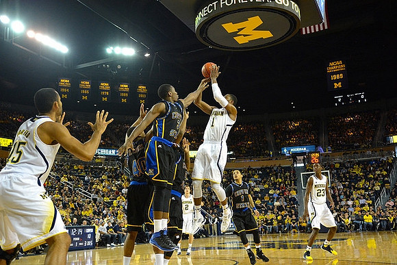 Jon Horford (15), Spike Albrecht (2), Derrick Walton Jr. (10), and Caris LeVert (23)