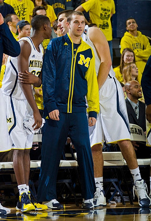 Caris LeVert (23), Nik Stauskas (11), Mitch McGary (4), and C.J. Lee