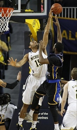Jon Horford (15) and Spike Albrecht (2)