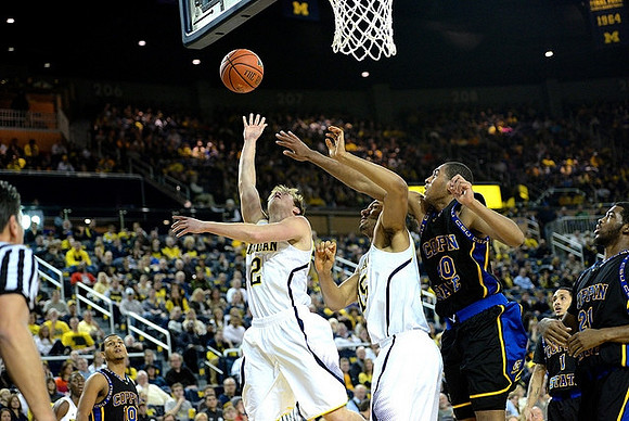 Spike Albrecht (2) and Jon Horford (15)