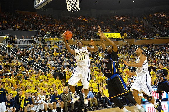 Derrick Walton Jr. (10) and Jon Horford (15)