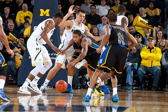 Glenn Robinson III (1) and Mitch McGary (4)