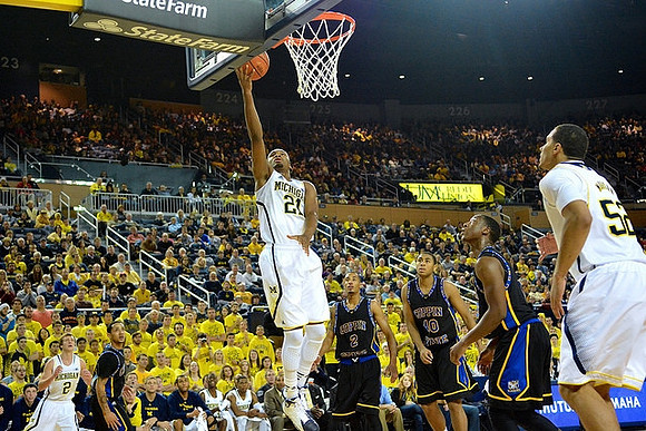 Spike Albrecht (2), Zak Irvin (21), and Jordan Morgan (52)