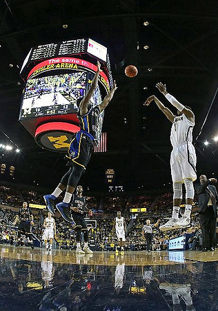 Spike Albrecht (2), Caris LeVert (23), and Glenn Robinson III (1)