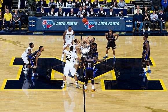 Derrick Walton Jr. (10), Glenn Robinson III (1), Jordan Morgan (52), and Mitch McGary (4)