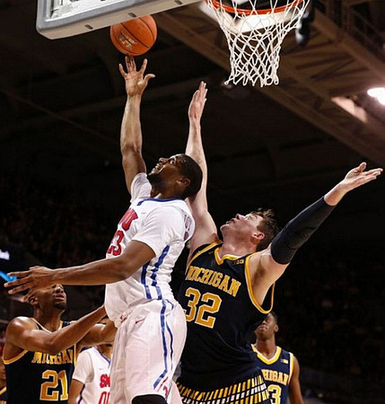 Zak Irvin (21), Ricky Doyle (32), and Caris LeVert (23)