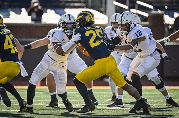 Jake McCurry (43) and Hassan Haskins (25)