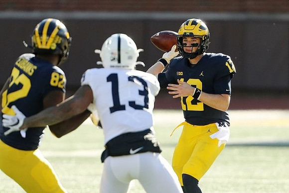 Nick Eubanks (82) and Cade McNamara (12)