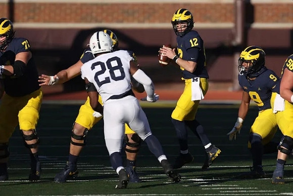 Andrew Stueber (71), Cade McNamara (12), Chris Evans (9), and Zach Carpenter (58)