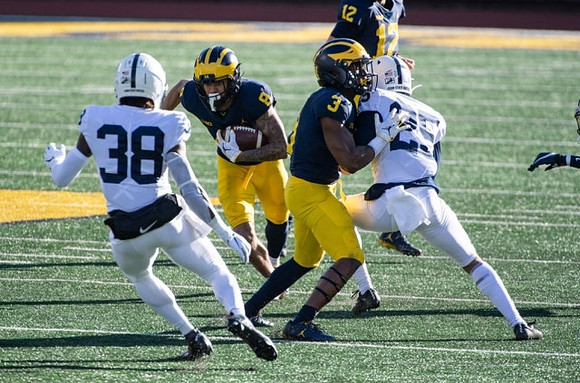 Ronnie Bell (8), A.J. Henning (3), and Cade McNamara (12)