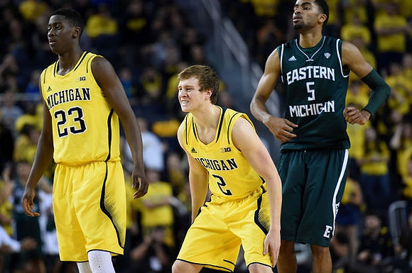 Caris LeVert (23) and Spike Albrecht (2)