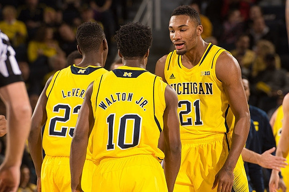 Caris LeVert (23), Derrick Walton Jr. (10), and Zak Irvin (21)