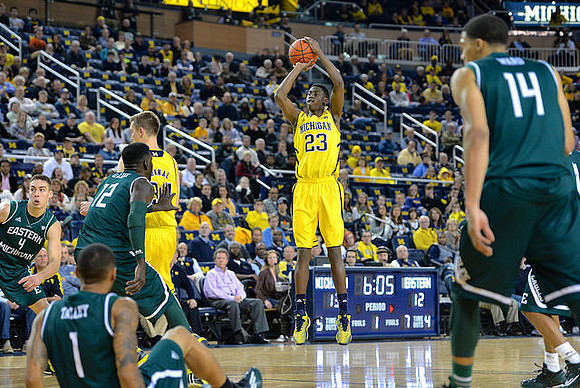 Mark Donnal (34) and Caris LeVert (23)