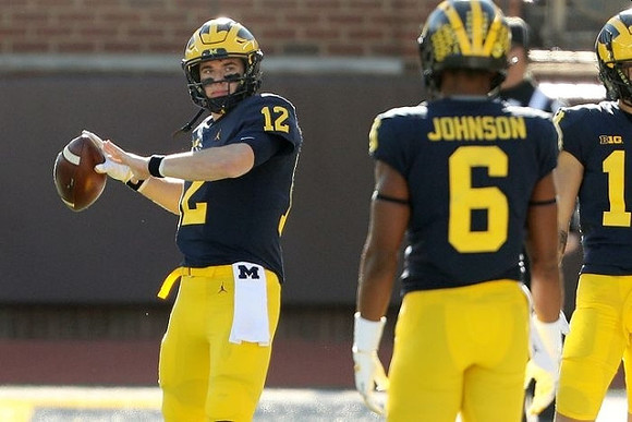 Cade McNamara (12) and Cornelius Johnson (6)