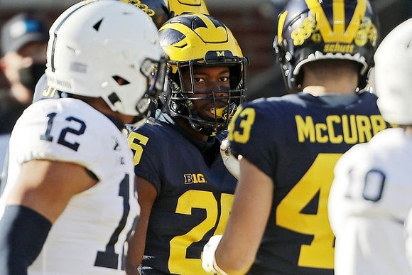 Hassan Haskins (25) and Jake McCurry (43)