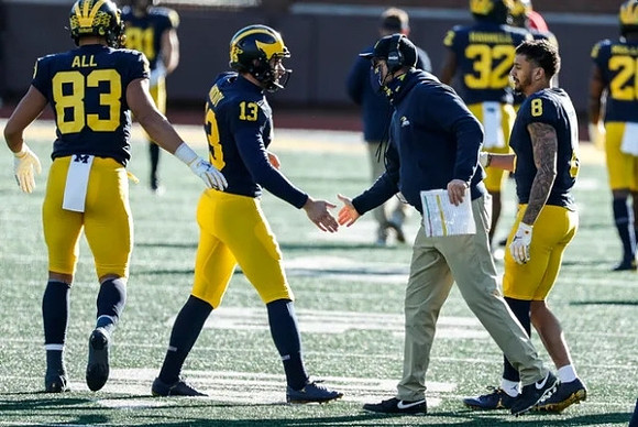 Erick All (83), Jake Moody (13), Jim Harbaugh, and Ronnie Bell (8)