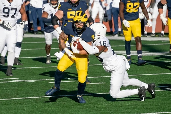 Blake Corum (2), Karsen Barnhart (52), and Nick Eubanks (82)