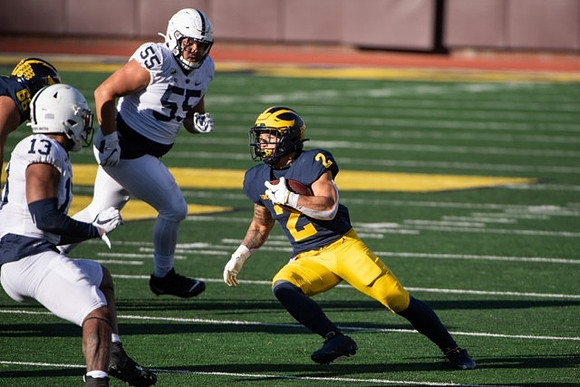 Chuck Filiaga (66) and Blake Corum (2)