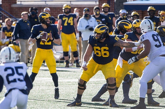 Cade McNamara (12), Chuck Filiaga (66), and Andrew Vastardis (68)