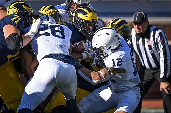 Andrew Stueber (71) and Hassan Haskins (25)