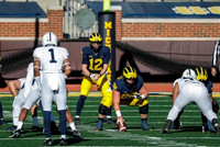Cade McNamara (12) and Zach Carpenter (58)