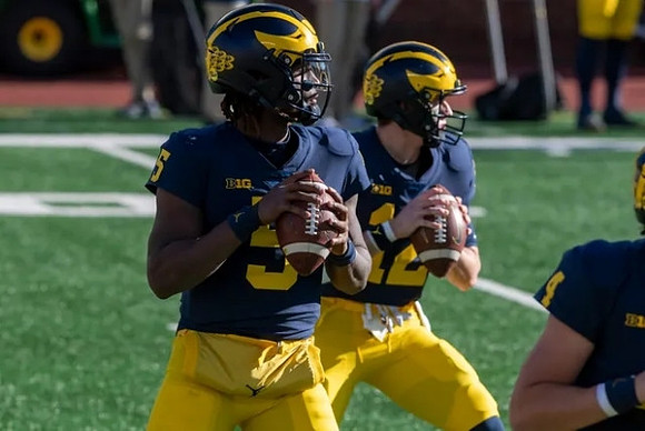 Joe Milton (5) and Cade McNamara (12)