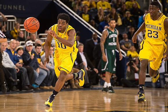 Derrick Walton Jr. (10) and Caris LeVert (23)