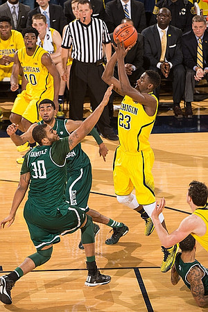 Derrick Walton Jr. (10) and Caris LeVert (23)