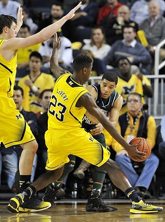 Ricky Doyle (32) and Caris LeVert (23)