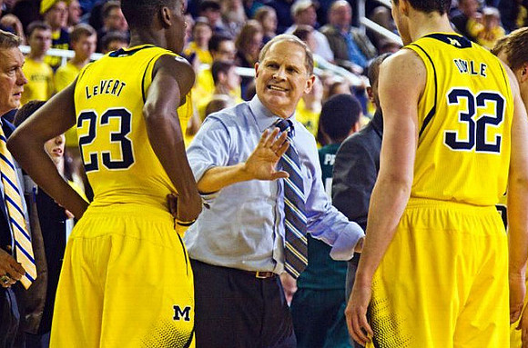 Caris LeVert (23), John Beilein, and Ricky Doyle (32)