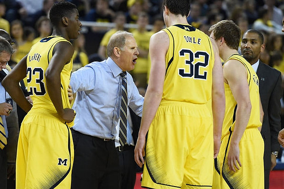 Caris LeVert (23), John Beilein, Ricky Doyle (32), Spike Albrecht (2). and LaVall Jordan