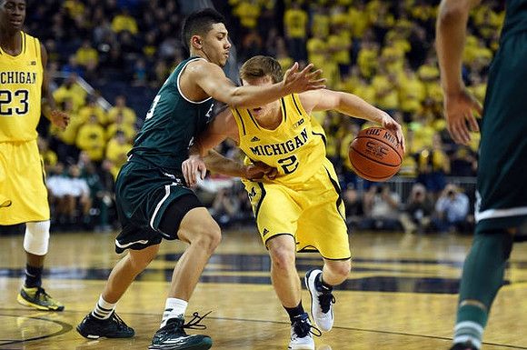 Caris LeVert (23) and Spike Albrecht (2)