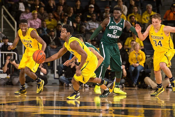 Caris LeVert (23), Derrick Walton Jr. (10), and Mark Donnal (34)