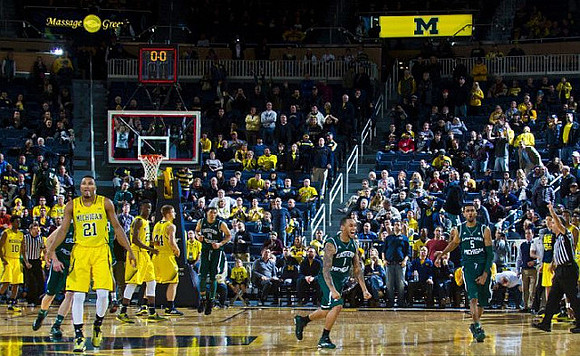 Derrick Walton Jr. (10), Zak Irvin (21), Caris LeVert (23), and Max Bielfeldt (44)