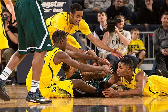 Caris LeVert (23), Muhammad-Ali Abdur-Rahkman (12), and Zak Irvin (21)