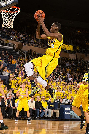 Spike Albrecht (2), Caris LeVert (23), and Max Bielfeldt (44)