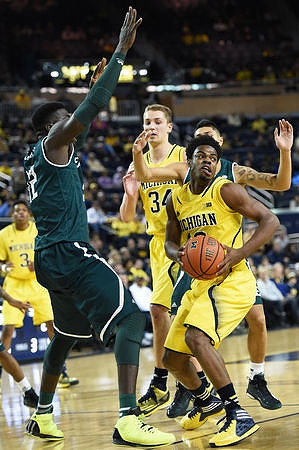 Kameron Chatman (3), Mark Donnal (34), and Derrick Walton Jr. (10)