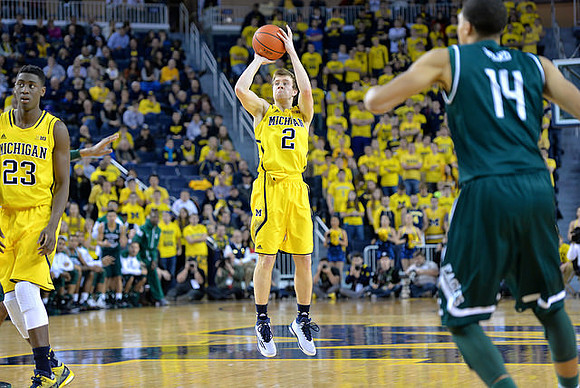 Caris LeVert (23) and Spike Albrecht (2)