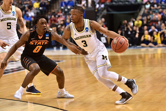 D.J. Wilson (5) and Xavier Simpson (3)
