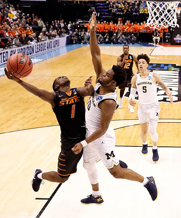 Derrick Walton Jr. (10) and D.J. Wilson (5)