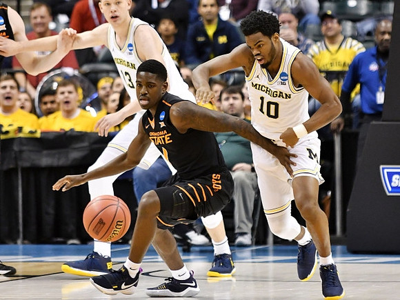 Moritz Wagner (13) and Derrick Walton Jr. (10)