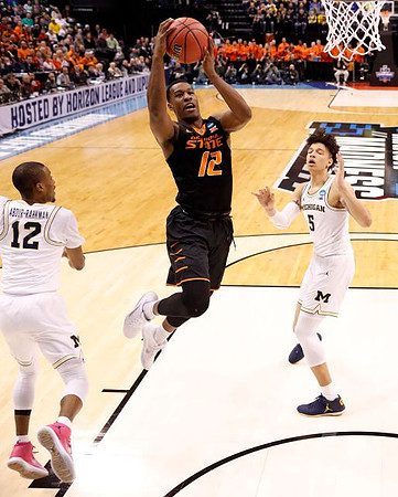 Muhammad-Ali Abdur-Rahkman (12) and D.J. Wilson (5)